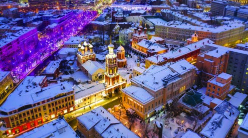 Aerial View Of Illuminated Buildings In City During Winter